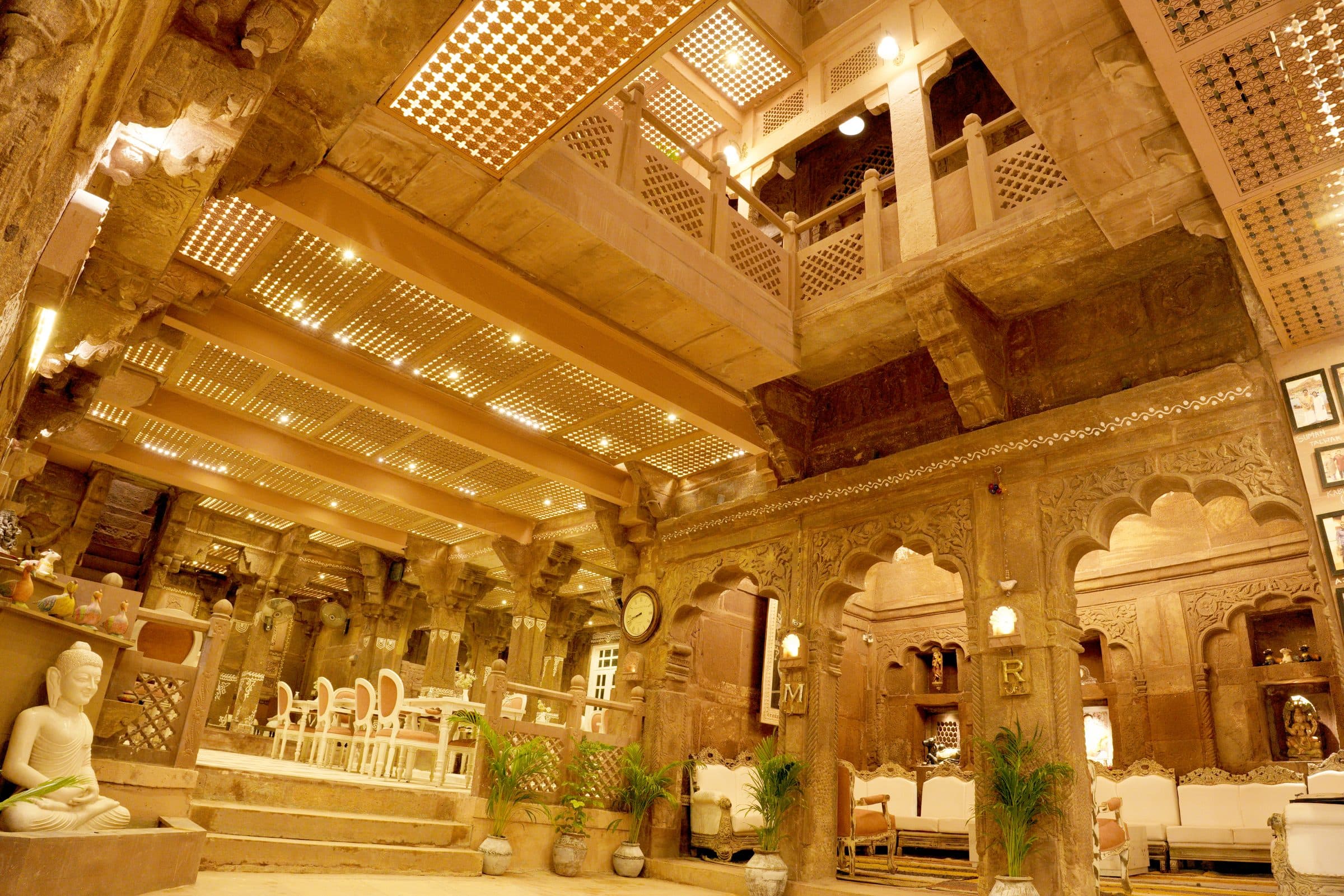 Carved sandstone balcony overlooking the courtyard at night